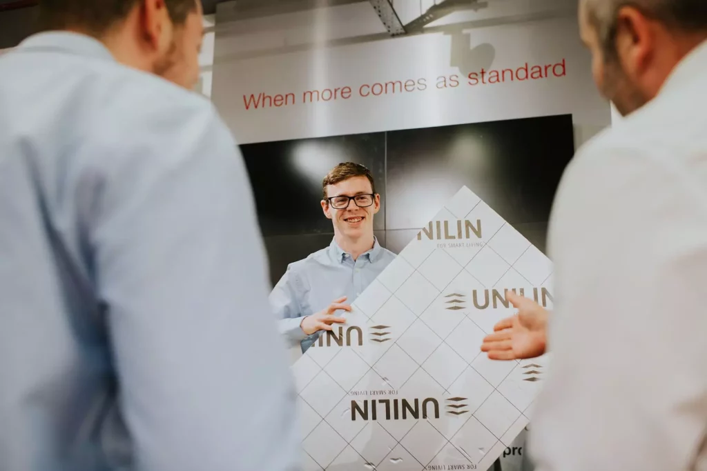 unilin employees presenting a product
