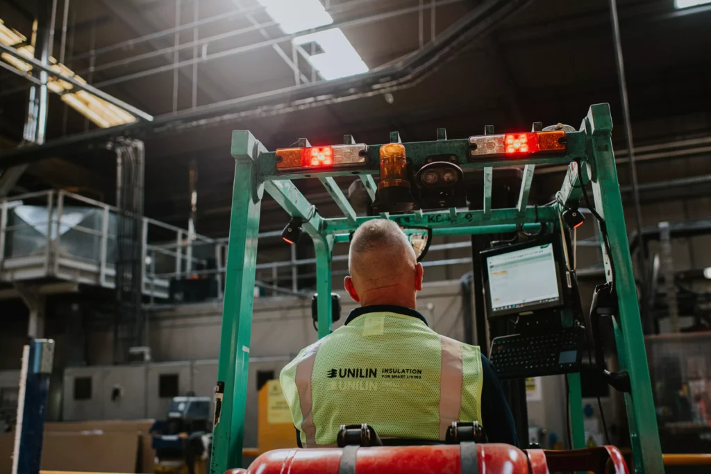 Man in forklift in Unilin Insulation Factory
