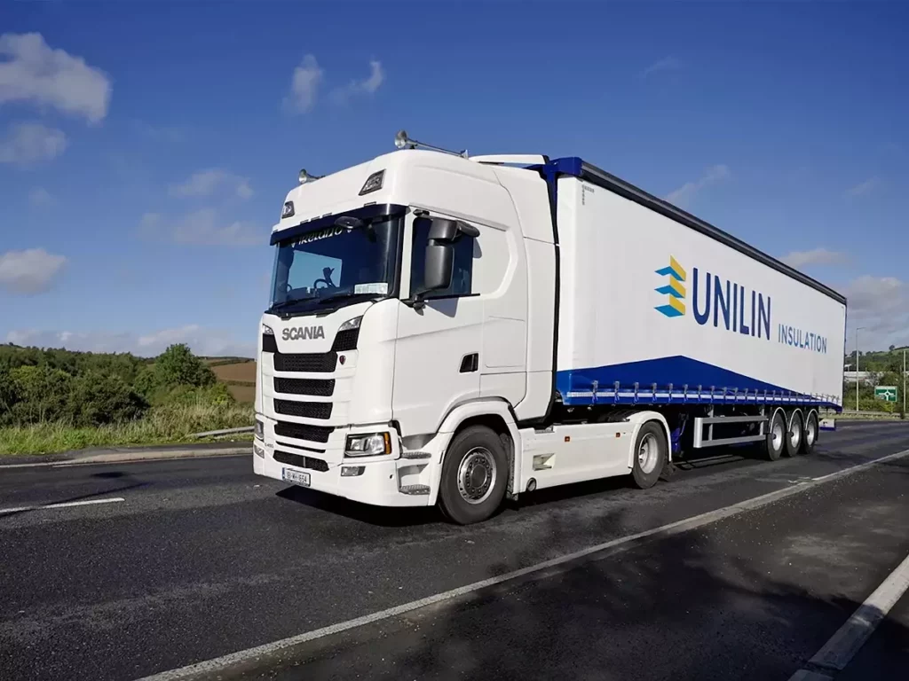 Unilin Insulation Lorry travelling on the road to deliver orders