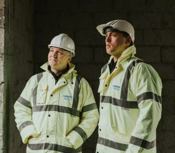two unilin insulation male engineers