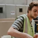 FACTORY employee working on production line