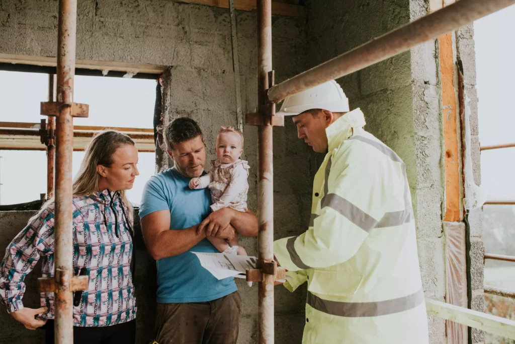 Unilin Insulation Technical team on site discussing u values and thermal bridging